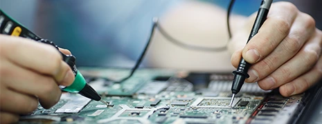 Technician performing equipment repair services